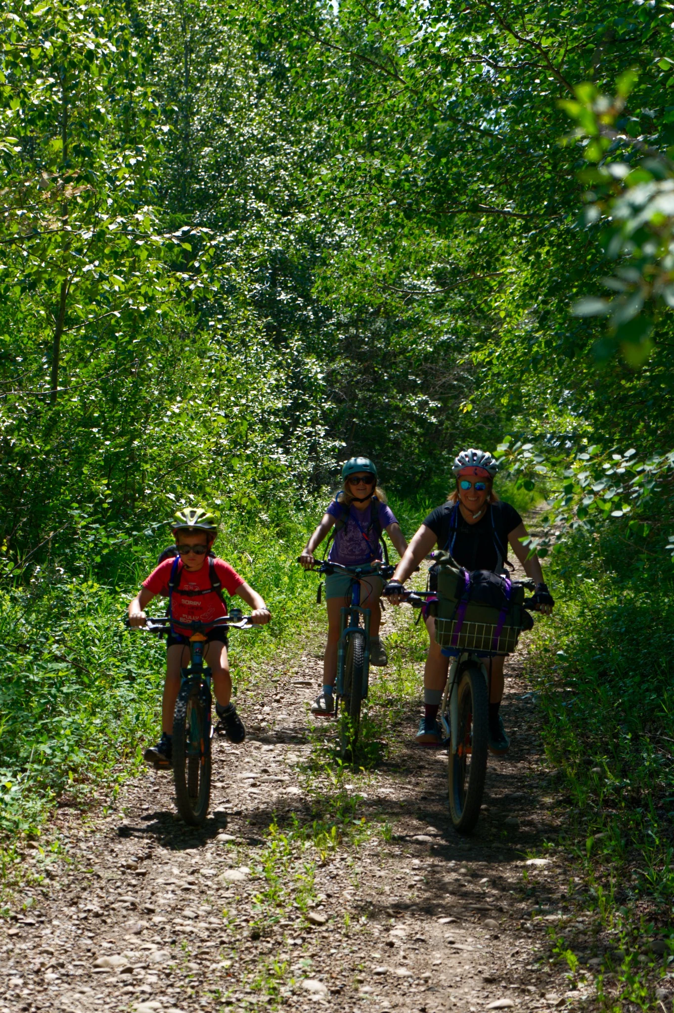 Family riding together on the Donalda abandoned rail trail