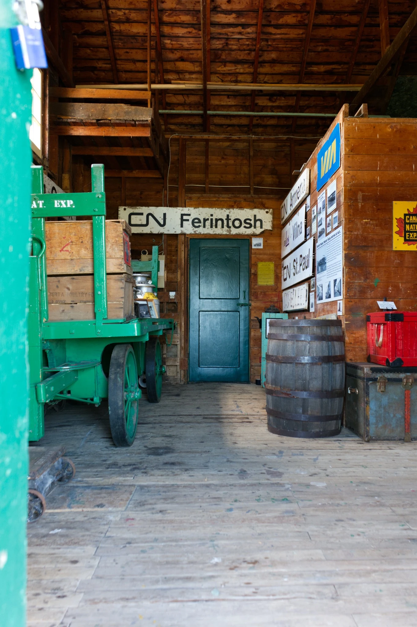 Historic railway equipment and Ferintosh sign inside the Meeting Creek station
